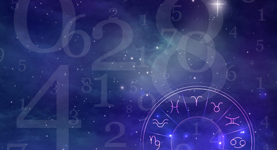 Numerology. Many numbers and zodiac wheel against sky